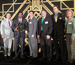 President Deepal S. Eliatamby, P.E., SCCED, and Alliance Consulting Engineers, Inc. staff accept the 2013 Roaring Twenties award for being one of South Carolina’s fastest growing businesses.